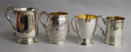 A Victorian silver christening mug, John Evans II, London, 1843 and three other later christening mugs, 16.5 oz.